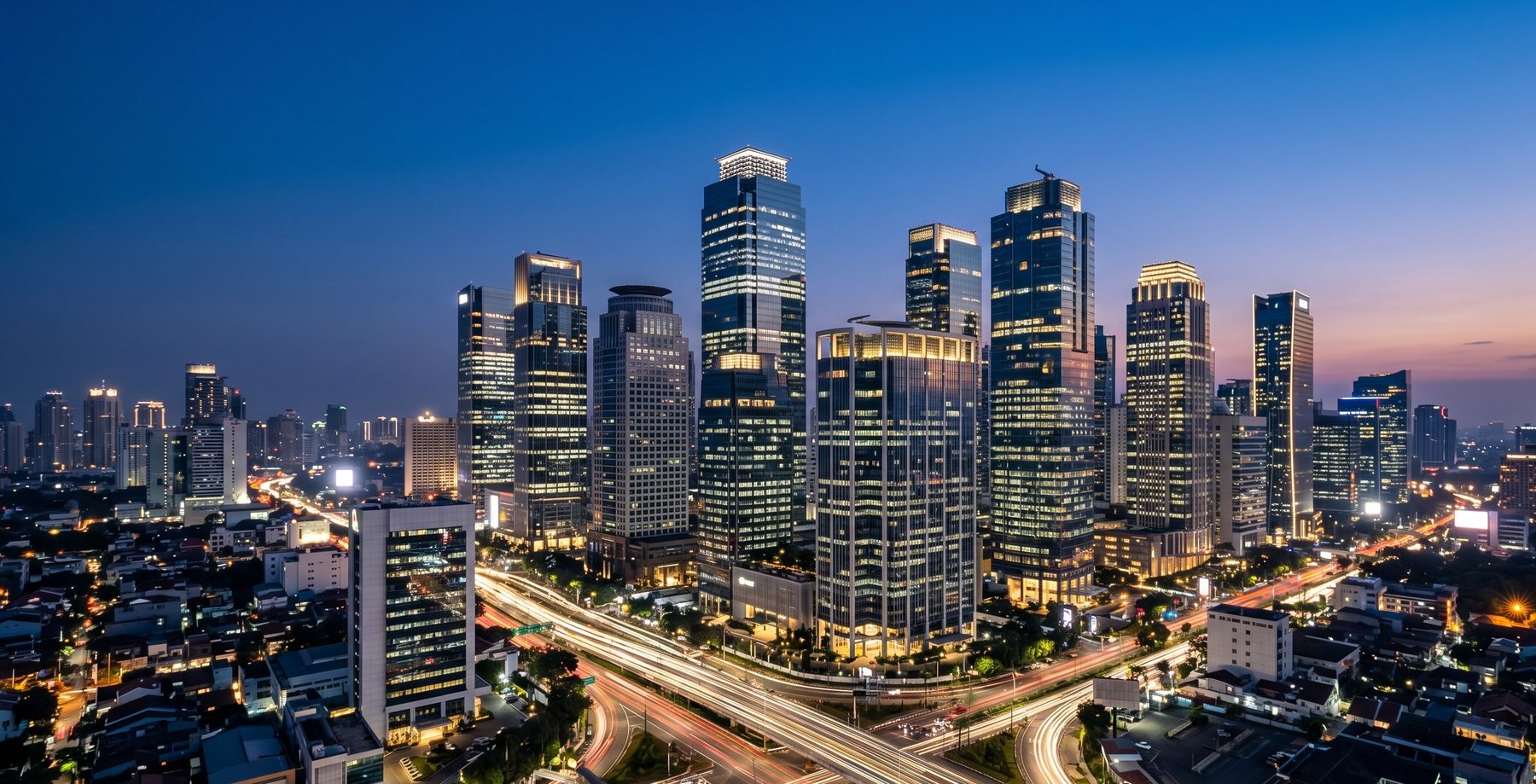 Jakarta city skyline at night with light trails, the dynamic home market of Majapahit Group, connecting Indonesia with global capital markets